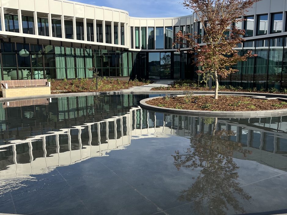 Architect-led community amenity building with integrated water element